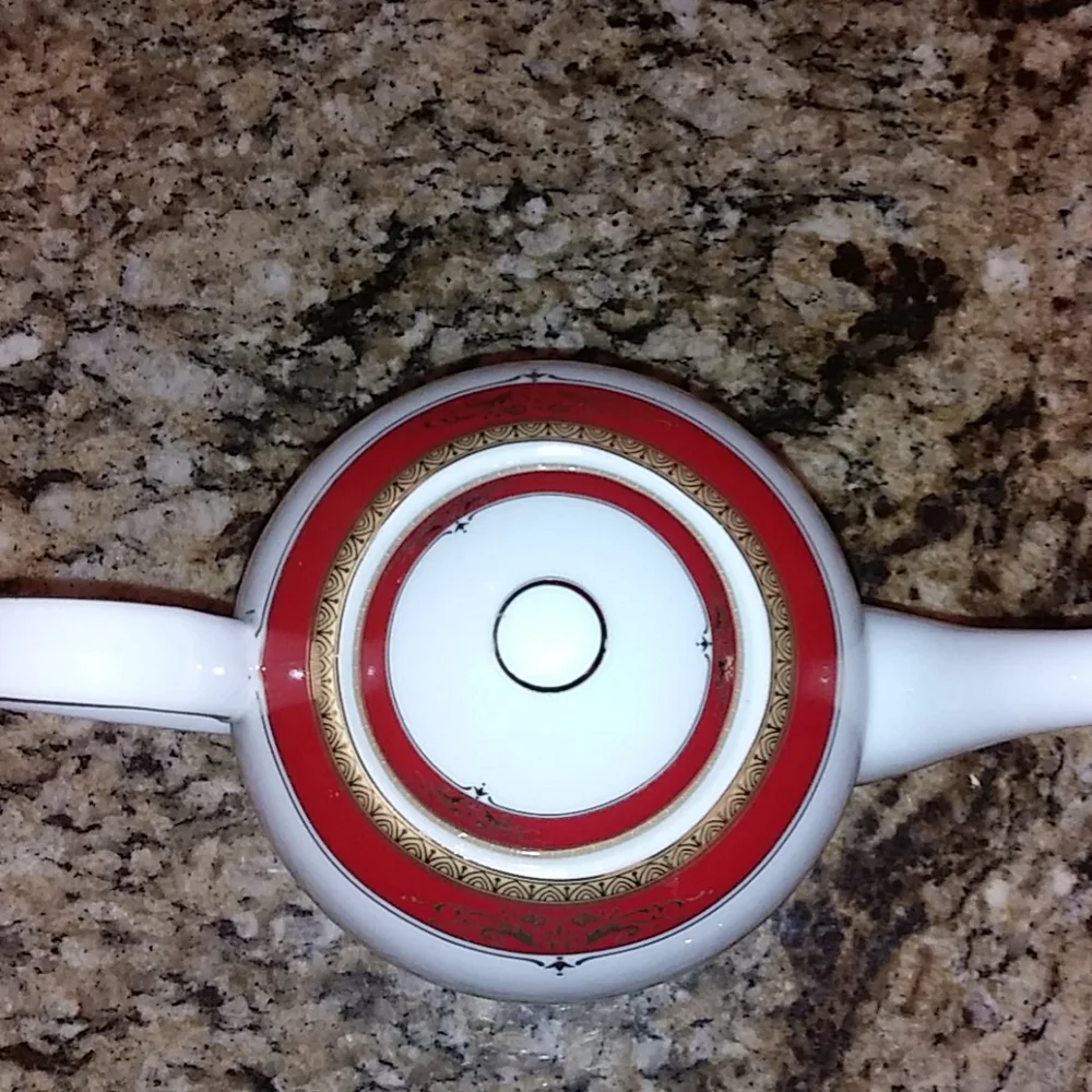 Elegant White Porcelain Teapot with Red and Gold Trim